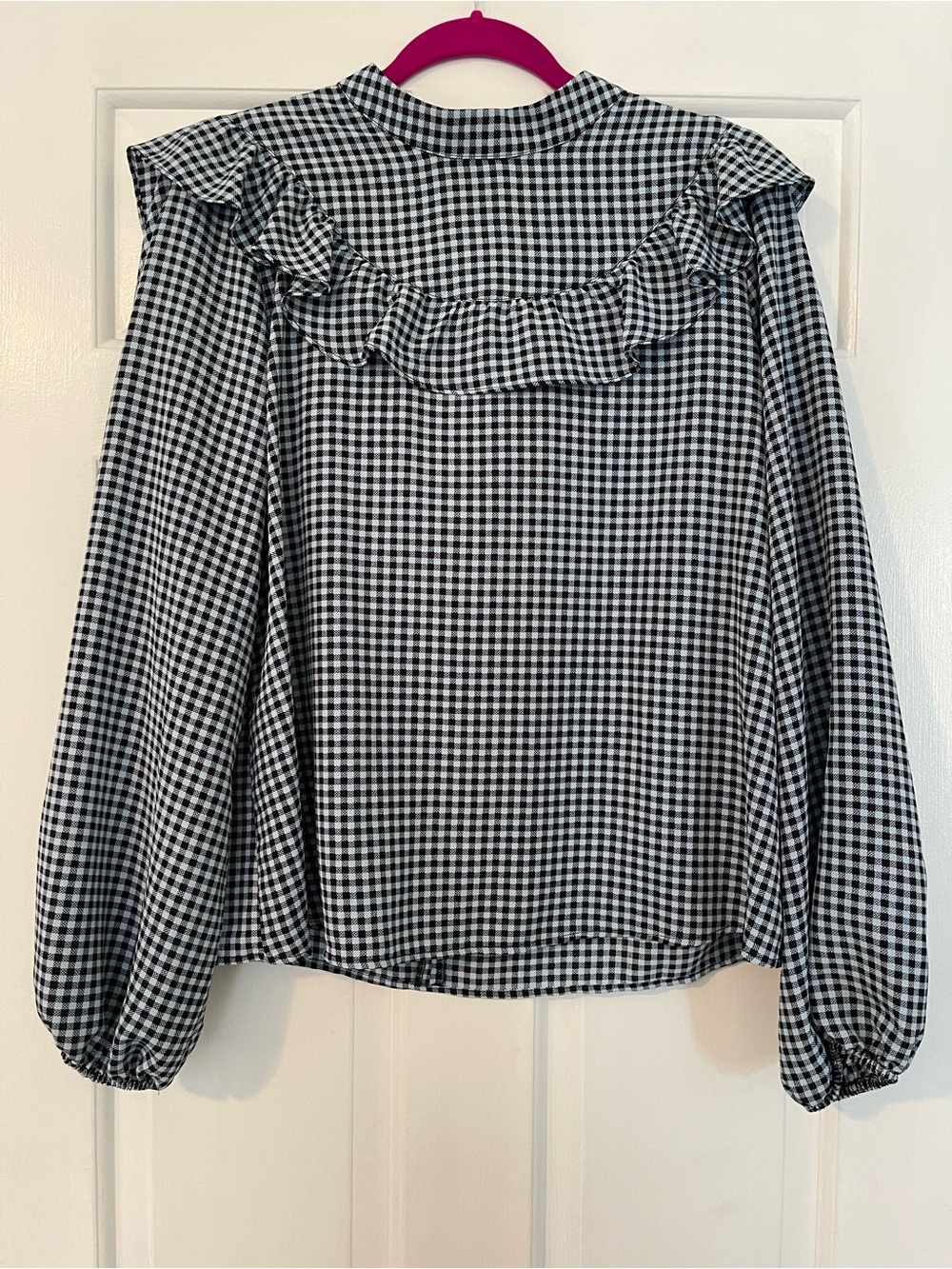 Topshop Ruffled Checkered Blouse
Size 16
Excellent condition